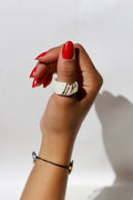 Une belle bague en céramique blanche et or taille 61 fr