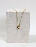 Collier en acier inoxydable avec un pendentif en donuts en porcelaine motif léopard 